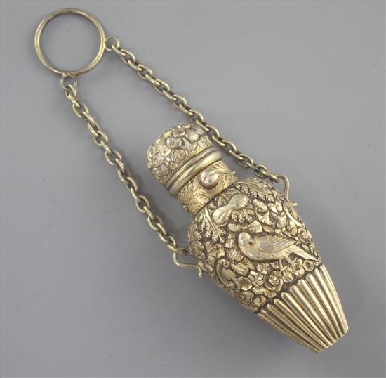 A Victorian silver gilt teardrop shaped scent bottle embossed with birds amongst foliage, 72mm.